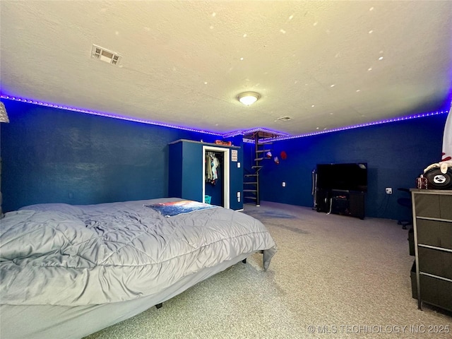 9585 Celia Berryhill Rd, Okmulgee, OK 74447 - bedroom with carpet, a closet, and a textured ceiling