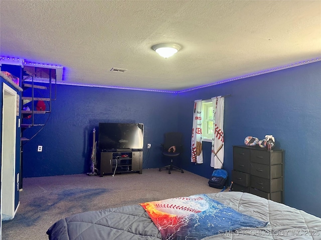 9585 Celia Berryhill Rd, Okmulgee, OK 74447 - bedroom with a textured ceiling, carpet flooring, and a textured wall