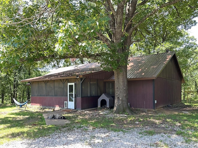 9585 Celia Berryhill Rd, Okmulgee, OK 74447 - view of property exterior with a metal roof
