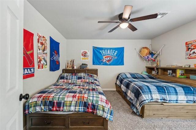 bedroom featuring carpet flooring, baseboards, ceiling fan, and visible vents