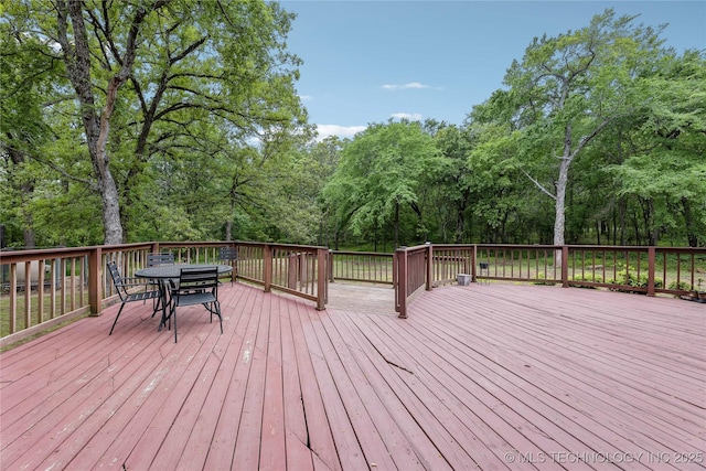 deck with outdoor dining space
