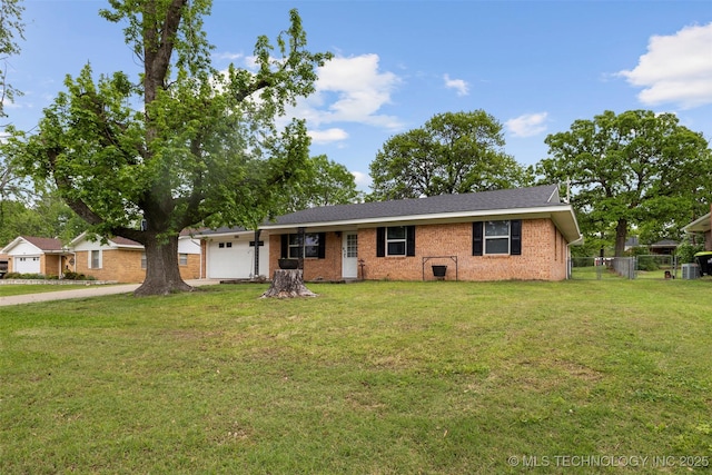 single story home featuring brick siding, fence, a garage, driveway, and a front lawn