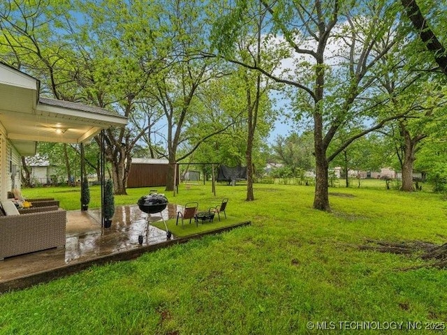 view of yard with a patio and a fire pit