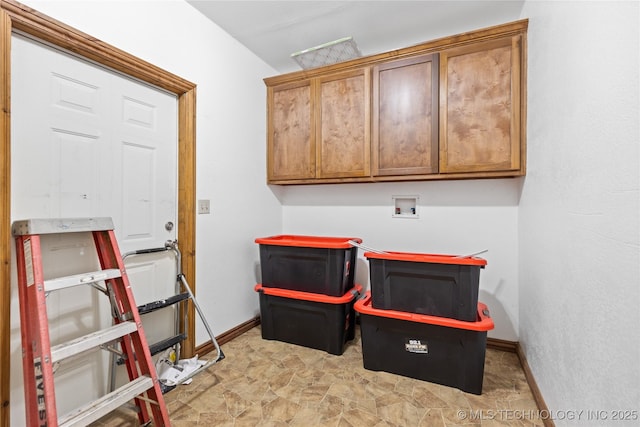 rec room with stone finish floor and baseboards