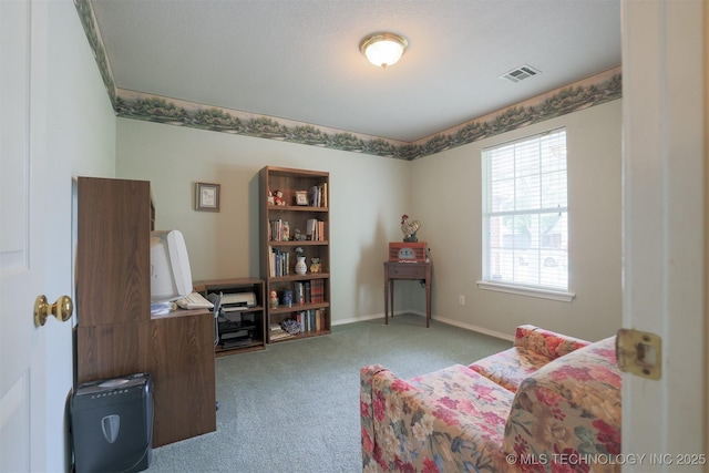sitting room with baseboards, visible vents, and carpet flooring