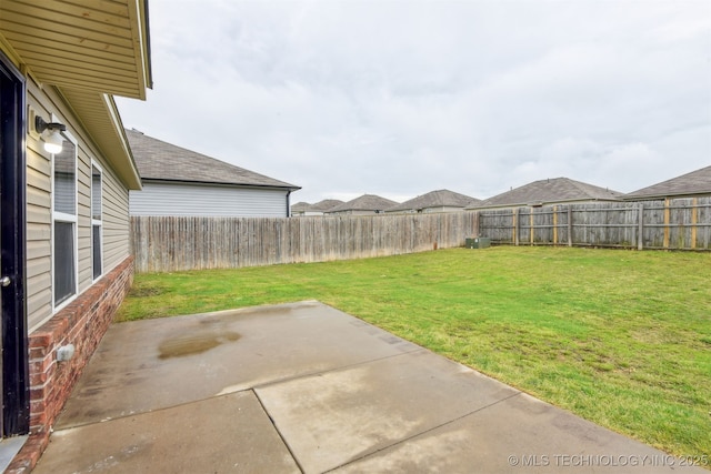 view of yard featuring a patio and a fenced backyard
