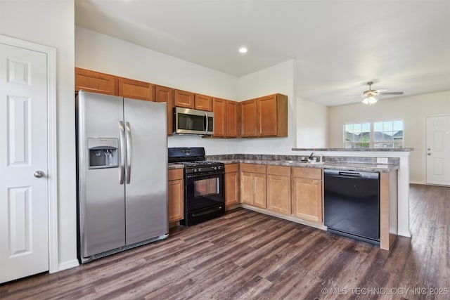 5974 E 146th Pl S, Bixby, OK 74008 - kitchen with black appliances, dark wood-style floors, a peninsula, a ceiling fan, and a sink