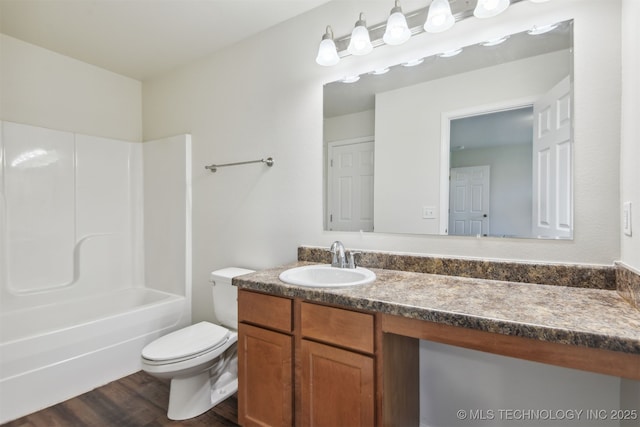5974 E 146th Pl S, Bixby, OK 74008 - bathroom with wood finished floors, toilet, vanity, and washtub / shower combination