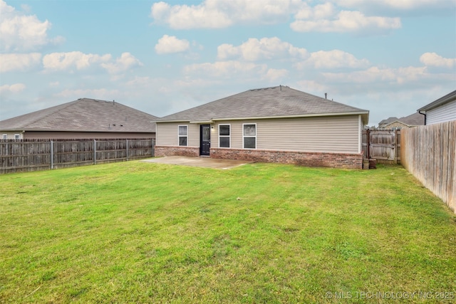 5974 E 146th Pl S, Bixby, OK 74008 - back of property with brick siding, a patio, and roof with shingles