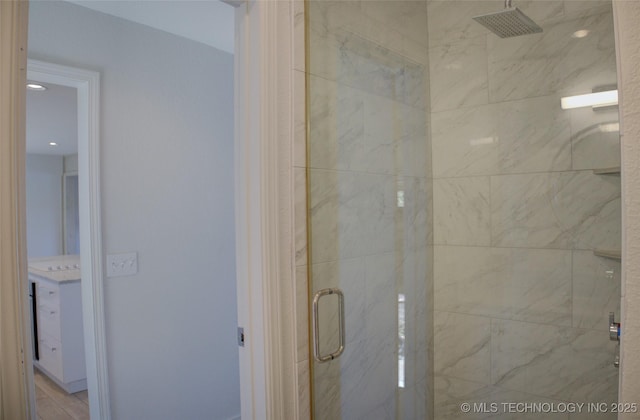 bathroom with a marble finish shower