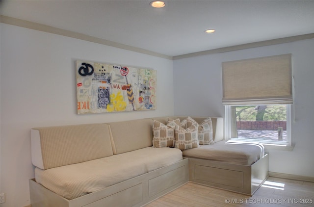 living area featuring light wood finished floors and recessed lighting