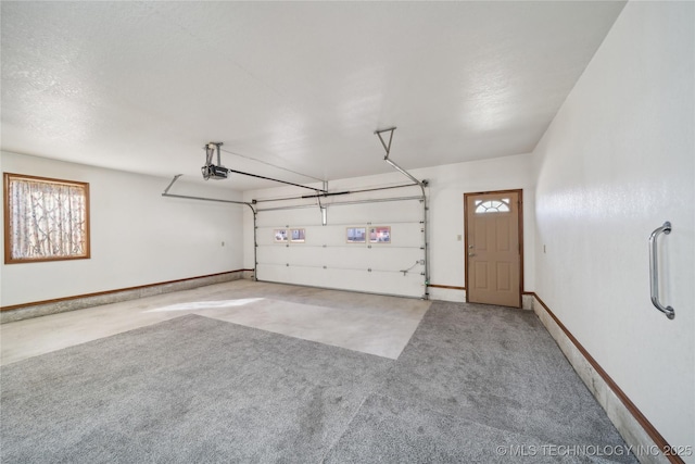 601 N Okmulgee Ave, Okmulgee, OK 74447 - garage featuring a garage door opener and baseboards