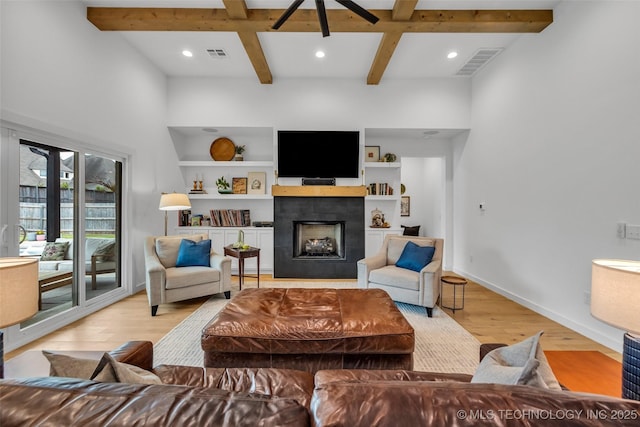11529 S Marion Ave, Tulsa, OK 74137 - living area with light wood-type flooring, a tile fireplace, coffered ceiling, beam ceiling, and recessed lighting