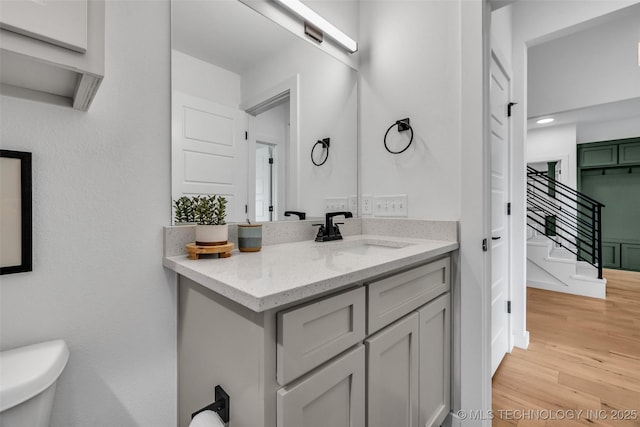 11529 S Marion Ave, Tulsa, OK 74137 - bathroom with wood finished floors, vanity, and toilet