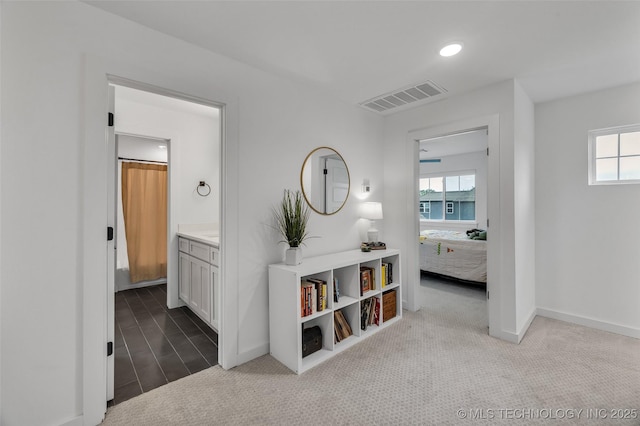 11529 S Marion Ave, Tulsa, OK 74137 - hallway with healthy amount of natural light, baseboards, carpet floors, and recessed lighting