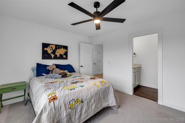 11529 S Marion Ave, Tulsa, OK 74137 - carpeted bedroom featuring baseboards, ensuite bathroom, and ceiling fan