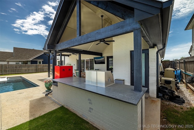 11529 S Marion Ave, Tulsa, OK 74137 - fenced backyard featuring ceiling fan, area for grilling, and a patio