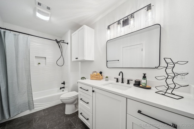 bathroom featuring toilet, shower / tub combo, and vanity