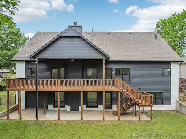 rear view of property featuring a deck, a patio area, stairs, and a chimney