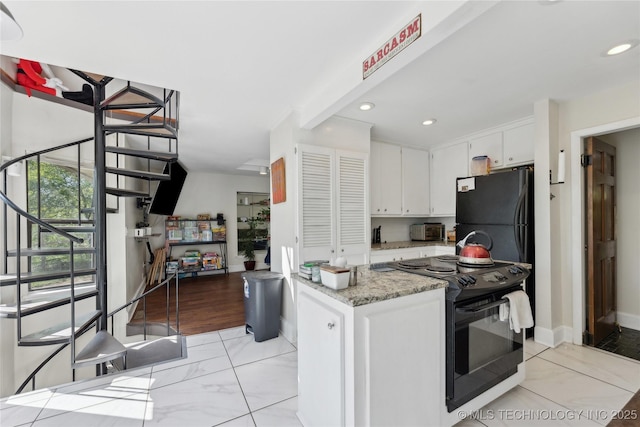 kitchen featuring recessed lighting, black appliances, light stone counters, baseboards, and white cabinets