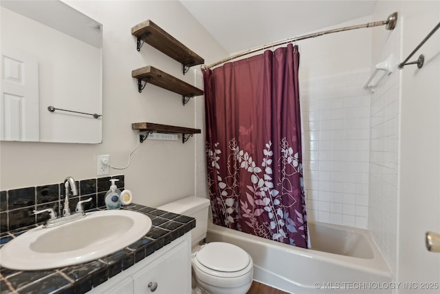 full bathroom featuring shower / tub combo, vanity, and toilet