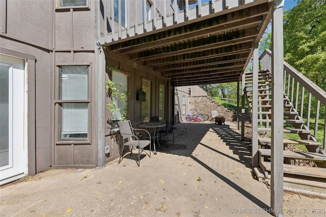 view of patio featuring stairs