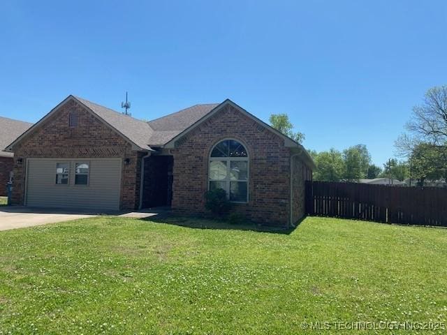 ranch-style house with fence, brick siding, and a front lawn