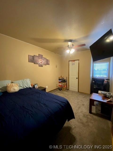 carpeted bedroom featuring a ceiling fan