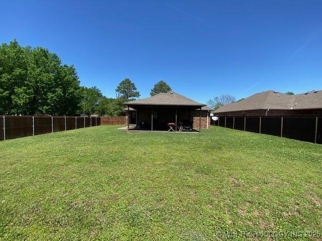 view of yard with a fenced backyard
