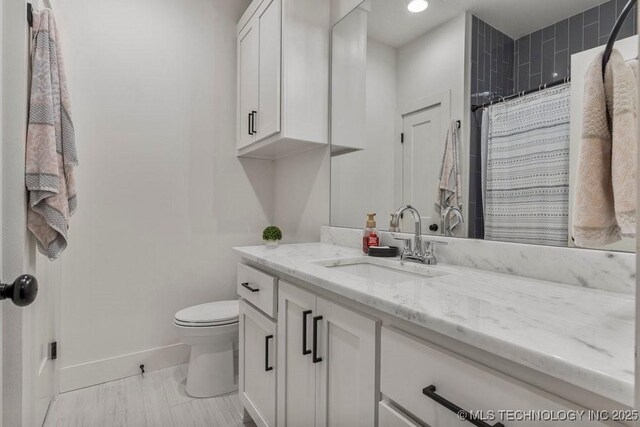 13722 S 20th Pl E, Bixby, OK 74008 - bathroom with toilet, vanity, a shower with curtain, and baseboards