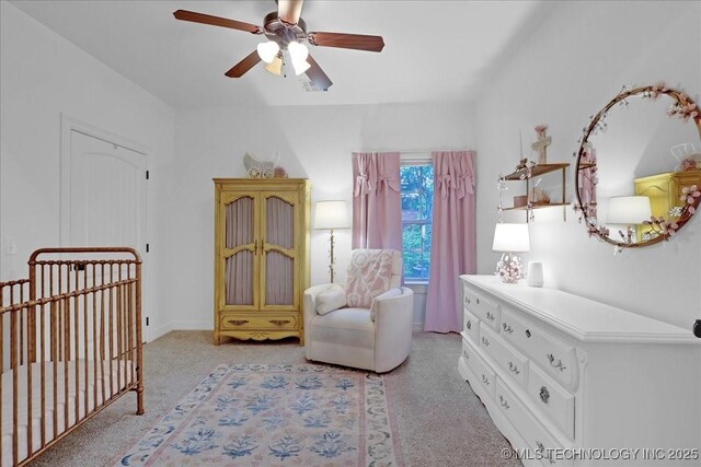 bedroom featuring ceiling fan and light colored carpet