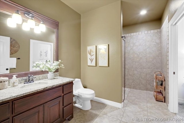 bathroom with baseboards, walk in shower, toilet, tile patterned floors, and vanity