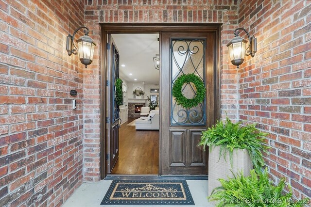 property entrance featuring brick siding