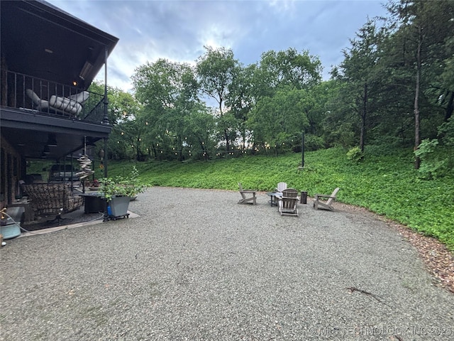 210 Woods Ln, Ardmore, OK 73401 - view of patio featuring an outdoor fire pit and a balcony