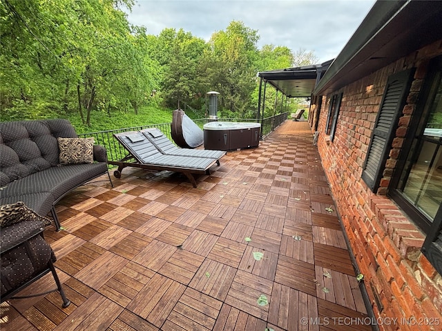 view of patio / terrace with a hot tub