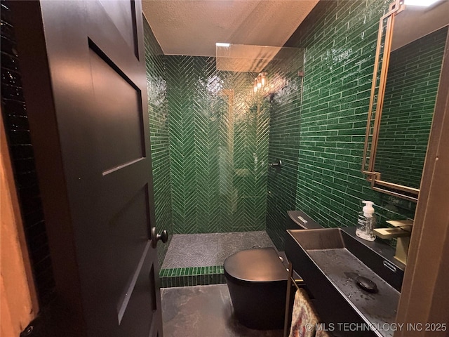 210 Woods Ln, Ardmore, OK 73401 - full bathroom with a tile shower, tile walls, vanity, and toilet