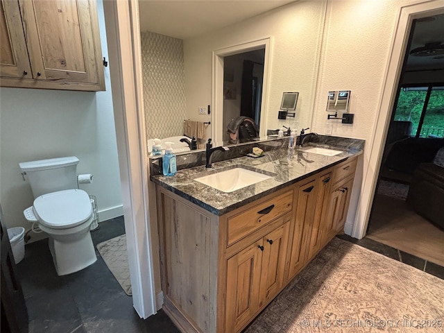 210 Woods Ln, Ardmore, OK 73401 - ensuite bathroom with double vanity, toilet, ensuite bathroom, and a sink