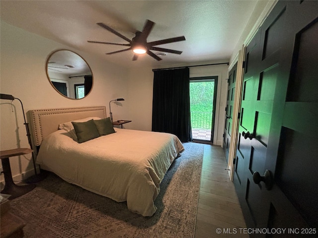 210 Woods Ln, Ardmore, OK 73401 - bedroom featuring wood finished floors, a ceiling fan, and access to exterior