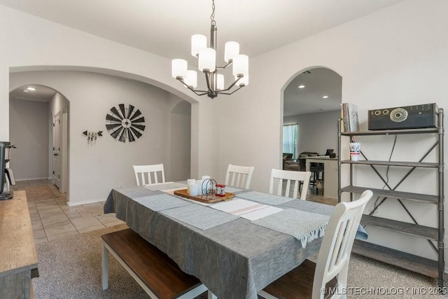 7305 S Walnut Ave, Broken Arrow, OK 74011 - dining area with arched walkways, a chandelier, and baseboards