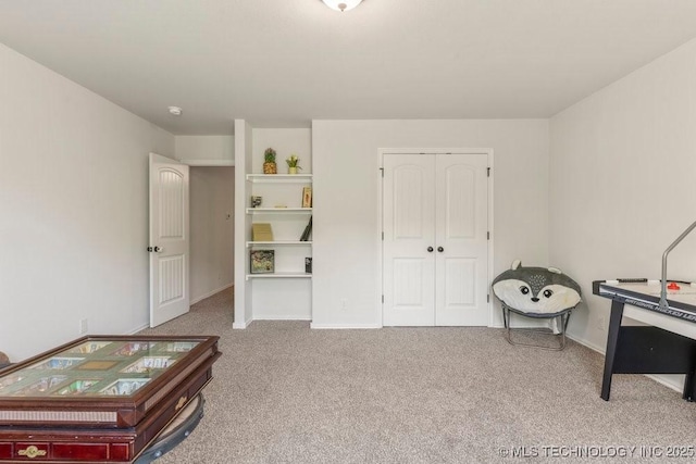 7305 S Walnut Ave, Broken Arrow, OK 74011 - carpeted bedroom featuring a closet and baseboards