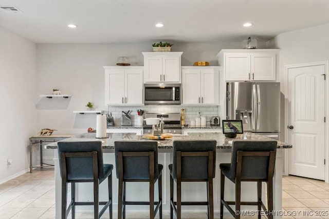 7305 S Walnut Ave, Broken Arrow, OK 74011 - kitchen featuring stainless steel appliances, white cabinetry, backsplash, light tile patterned flooring, and recessed lighting