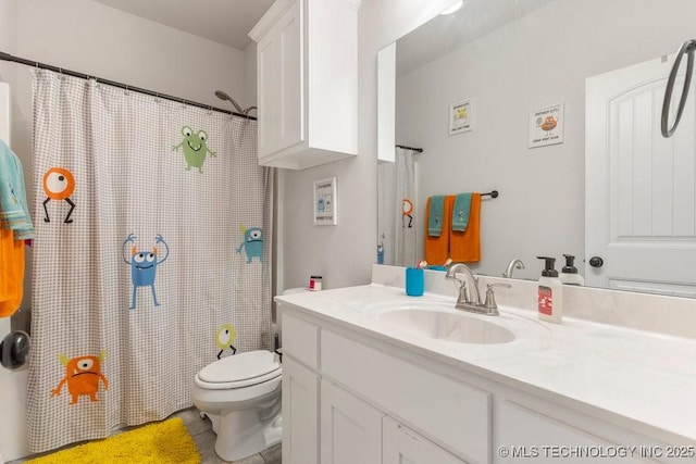 7305 S Walnut Ave, Broken Arrow, OK 74011 - full bathroom featuring vanity, toilet, a shower with shower curtain, and tile patterned floors