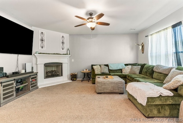 7305 S Walnut Ave, Broken Arrow, OK 74011 - living area featuring ceiling fan, carpet flooring, and a fireplace with raised hearth