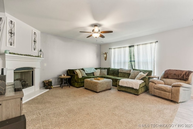 7305 S Walnut Ave, Broken Arrow, OK 74011 - living area featuring ceiling fan, a fireplace with raised hearth, and carpet floors