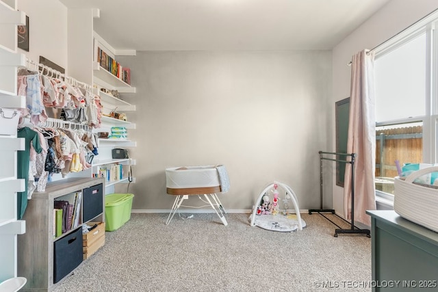 7305 S Walnut Ave, Broken Arrow, OK 74011 - rec room with healthy amount of natural light, carpet flooring, and baseboards