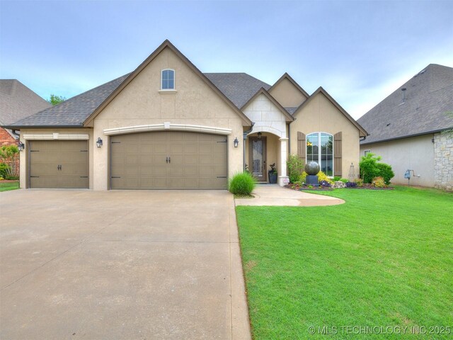 16321 E 48th Pl, Tulsa, OK 74134 - french country inspired facade featuring a front lawn, driveway, an attached garage, and stucco siding
