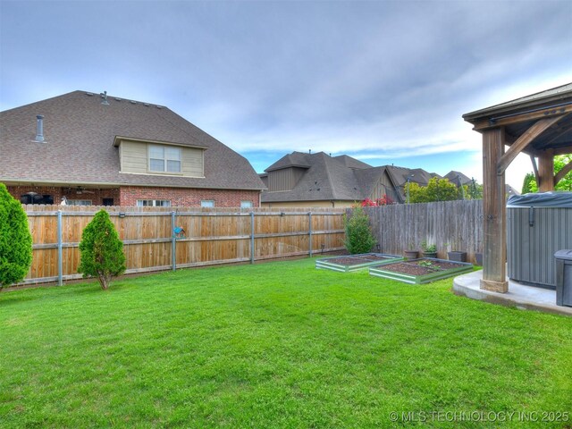 16321 E 48th Pl, Tulsa, OK 74134 - view of yard with a vegetable garden and a fenced backyard