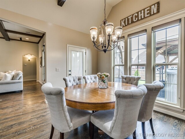 16321 E 48th Pl, Tulsa, OK 74134 - dining room with arched walkways, baseboards, a chandelier, and dark wood-type flooring