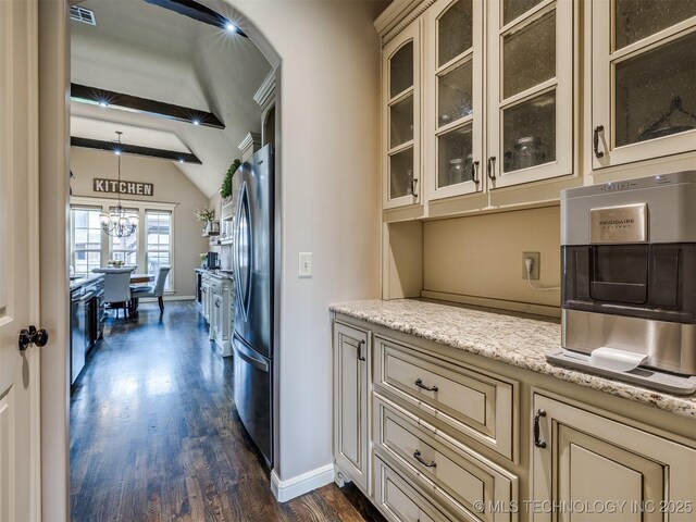 16321 E 48th Pl, Tulsa, OK 74134 - kitchen featuring lofted ceiling with beams, cream cabinets, freestanding refrigerator, dark wood-style flooring, and visible vents