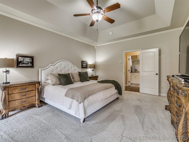 16321 E 48th Pl, Tulsa, OK 74134 - bedroom featuring ornamental molding, baseboards, a tray ceiling, and carpet flooring